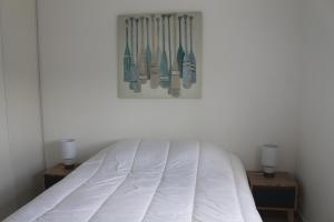 En eller flere senge i et værelse på Appartement la Rochelle
