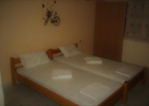 Postel nebo postele na pokoji v ubytování En Leuko Apartments