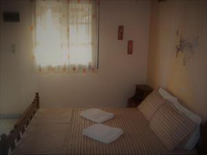Postel nebo postele na pokoji v ubytování En Leuko Apartments