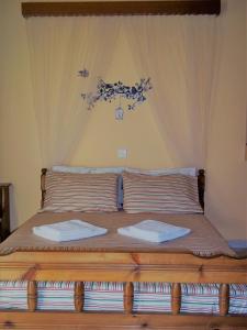 Postel nebo postele na pokoji v ubytování En Leuko Apartments