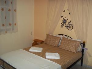 Postel nebo postele na pokoji v ubytování En Leuko Apartments