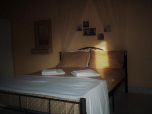 Postel nebo postele na pokoji v ubytování En Leuko Apartments