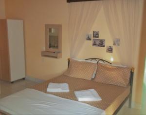 Postel nebo postele na pokoji v ubytování En Leuko Apartments