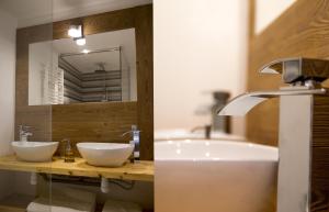 a bathroom with two sinks and a tub and a mirror at Le Passe Montagne in Uvernet-Fours +14 photos