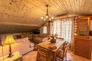 a living room with a couch and a table in a room at Hotel Hera in Skala Potamias