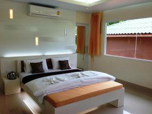 Postel nebo postele na pokoji v ubytování Mountain Resort Koh Lipe
