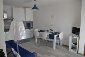 a kitchen and dining room with a table and chairs at Charming Place 2 Taormina in Taormina