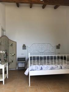 Uma cama ou camas num quarto em Stella d'Argento
