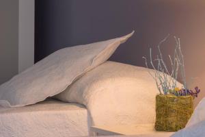 A bed or beds in a room at Hostal Arribes del Duero