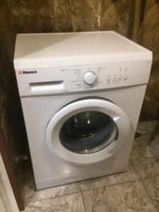 a washer and dryer in a small room at Gorgasali street Apartment in Batumi