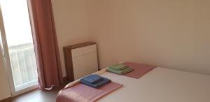 Postel nebo postele na pokoji v ubytování Apartmani Jozic