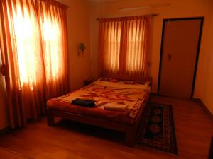 Postel nebo postele na pokoji v ubytování Le Rhododendron Chambres D'hotes