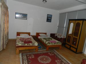 Postel nebo postele na pokoji v ubytování Le Rhododendron Chambres D'hotes