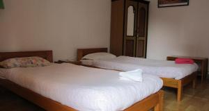 Postel nebo postele na pokoji v ubytování Le Rhododendron Chambres D'hotes