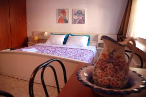 A bed or beds in a room at Villa Aleka