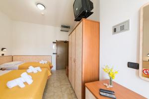 Postel nebo postele na pokoji v ubytování Hotel Garisenda