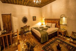 Postel nebo postele na pokoji v ubytování Mira Cappadocia Hotel