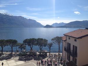 a view of a body of water with a building at La Dependance in Menaggio