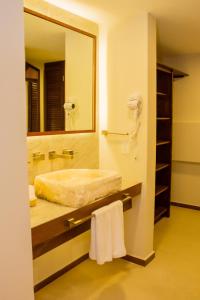 a bathroom with a sink and a mirror at Hotel Azul Maya in Isla Mujeres +129 photos