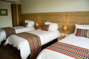 Ένα ή περισσότερα κρεβάτια σε δωμάτιο στο Alko Hotel Integrado