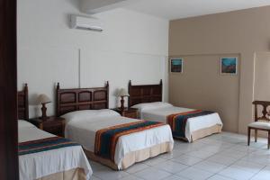Postel nebo postele na pokoji v ubytování Hotel Mayto + 33 fotografií
