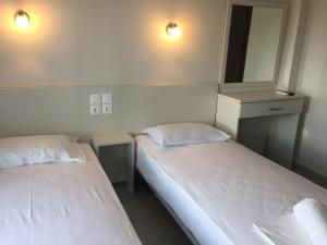 Postel nebo postele na pokoji v ubytování Seaside Apartments Flogita
