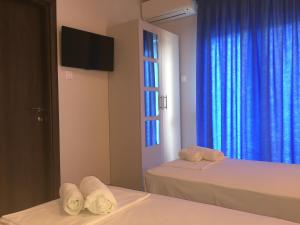 Postel nebo postele na pokoji v ubytování Seaside Apartments Flogita