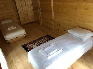A bed or beds in a room at Aden River