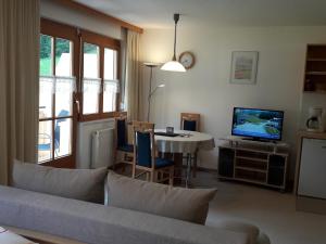 Un televizor și/sau centru de divertisment la Apartments Rumpler