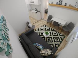 a living room with a couch and a table at Apartments Sari in Sarajevo