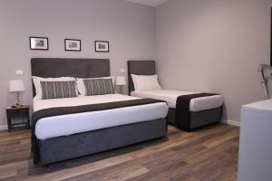 Postel nebo postele na pokoji v ubytování BeA Guest House
