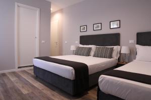 Postel nebo postele na pokoji v ubytování BeA Guest House