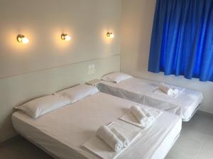 Postel nebo postele na pokoji v ubytování Seaside Apartments Flogita