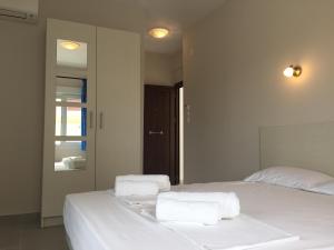 Postel nebo postele na pokoji v ubytování Seaside Apartments Flogita