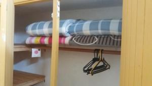 a shelf with surfboards on it in a room at Apartamentos del Este in Piriápolis