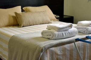 Cama ou camas em um quarto em Abril Hotel Boutique