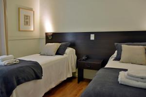 Una cama o camas en una habitación de Abril Hotel Boutique