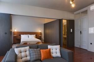 En eller flere senge i et værelse på Oporto Cozy Design Studio - Solar da Avenida