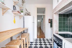 a kitchen with a black and white checkered floor at Lisbon Lodge in Lisbon +122 photos