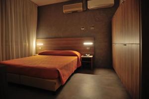 Postel nebo postele na pokoji v ubytování Hotel Lidia
