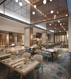 Um restaurante ou outro lugar para comer em The Qube Hotel Shanghai Sanjiagang - Offer Pudong International Airport and Disney shuttle
