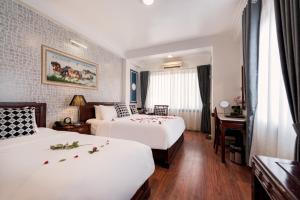 Postel nebo postele na pokoji v ubytování Prince II Hotel