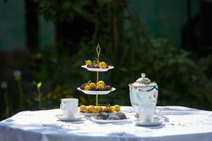 a table with two plates of food on top at Sweetnight in Mestia