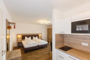 Postel nebo postele na pokoji v ubytování Come IN Hotel