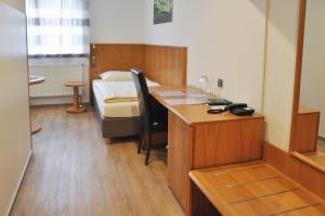 Postel nebo postele na pokoji v ubytování Garni Hotel Alber