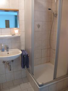 a bathroom with a shower and a sink at Ski Lodge Jaktman in Bad Gastein