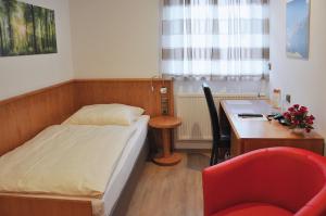 Postel nebo postele na pokoji v ubytování Garni Hotel Alber
