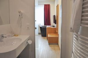 Koupelna v ubytování Garni Hotel Alber + 37 fotografií