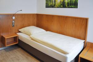 Postel nebo postele na pokoji v ubytování Garni Hotel Alber