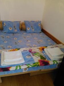 a bed with towels and napkins on it at Viki in Burgas
